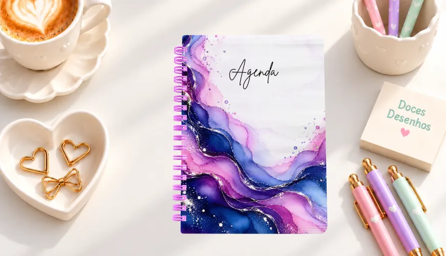 Agenda 2027 com capa em aquarela azul, roxa e rosa marmorizada