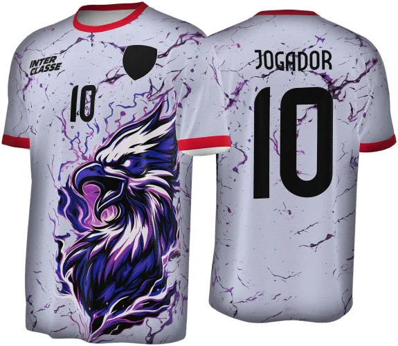 Camisa branca com gola e mangas vermelhas, águia roxa estilizada na frente, número 10 e texto INTER CLASSE em preto, costas com nome JOGADOR e número 10 em preto, fundo com efeito de rachaduras roxas.