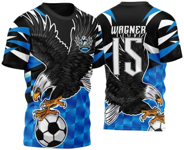 Camisa azul e preta com águia preta segurando bola de futebol na frente e nas costas, nome WAGNER e número 15 em branco, detalhes geométricos e escudo Eagle Soccer Academy no peito.