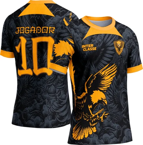 Camisa preta com gola e punhos laranja, na frente águia dourada em voo, texto INTER CLASSE e escudo com águia; nas costas número 10 e palavra JOGADOR em laranja, fundo com padrão gráfico cinza.