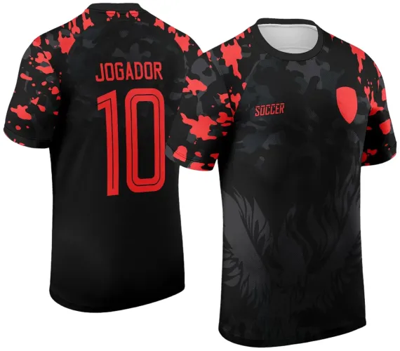 Camisa preta com estampa de águia escura na frente, detalhes em vermelho nas mangas, escudo vermelho do lado esquerdo e texto 'SOCCER'. Costas com nome 'JOGADOR' e número 10 em vermelho.