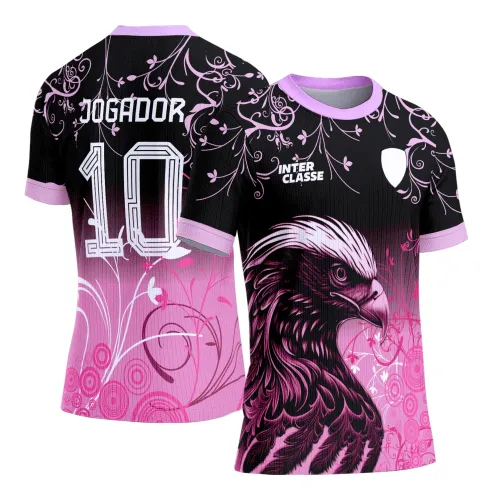 Camisa com frente preta e rosa com águia rosa detalhada, texto INTER CLASSE no peito e escudo branco, costas com fundo preto e rosa, arabescos florais e textos JOGADOR e número 10 em branco.