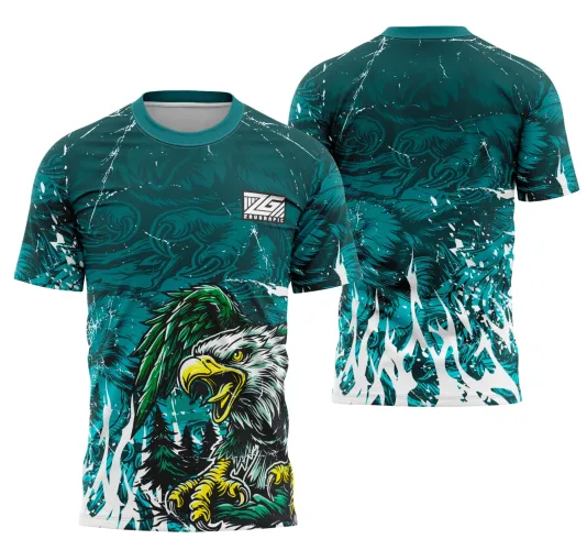 Camisa com desenho frontal de águia em tons verdes e amarelos com bico aberto sobre fundo verde escuro com nuvens e detalhes brancos. Costas apresentam fundo verde com padrão branco em chamas, sem textos adicionais, e logo ZG no peito direito.