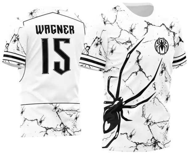 Camisa branca com grandes marcas rachadas pretas, diversas aranhas pretas pequenas e uma grande aranha estilizada na frente. Costas com nome WAGNER e número 15 em preto, além de detalhes de texturas e aranhas pequenas.