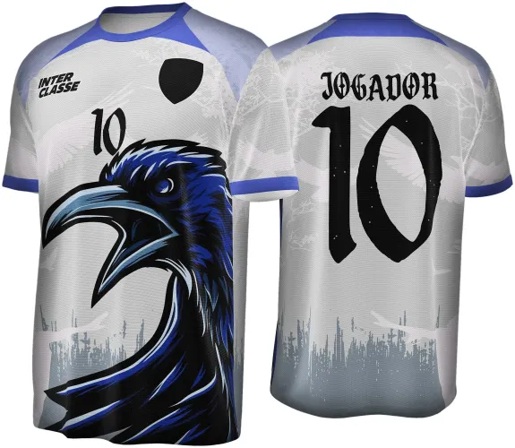 Camisa branca com gola azul marinho, na frente grande corvo azul e preto com número 10 e escritos INTER CLASSE e escudo preto. Nas costas texto JOGADOR e número 10 em preto, com detalhes de asas brancas ao fundo e faixa azul na gola e punhos.