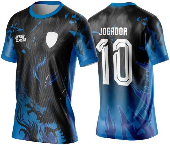 Camisa com frente preta e azul, com fênix em destaque, texto INTER CLASSE e escudo branco, costas em degradê azul-preto com número 10 e texto JOGADOR em branco, detalhes em estilo chama.