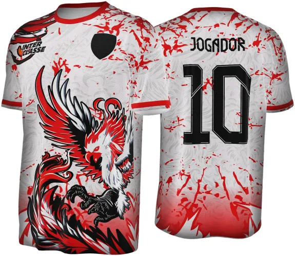 Camisa branca com bordas vermelhas e estampa frontal de uma fênix vermelha, branca e preta com garras abertas, além do texto INTER CLASSE e escudo preto. Nas costas, nome JOGADOR e número 10 em preto, com manchas vermelhas no fundo.