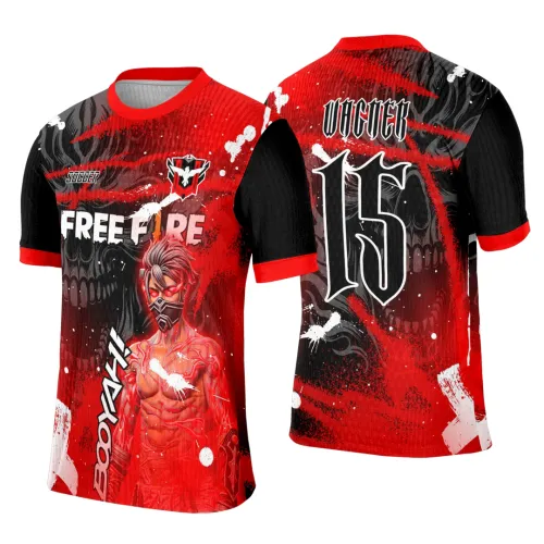 Camisa vermelha com mangas pretas e gola vermelha. Frente com personagem de olhos vermelhos e máscara, texto FREE FIRE e BOOYAH. Costas com número 15, nome VICNER e caveira cinza no fundo, com detalhes em branco e preto.