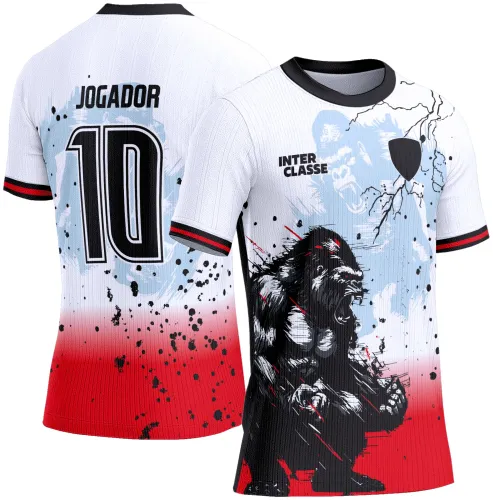 Camisa com gorila feroz em preto e branco na frente sobre degradê azul, branco e vermelho, com textos INTER CLASSE e escudo preto. Nas costas fundo similar com número 10 e texto JOGADOR em preto.