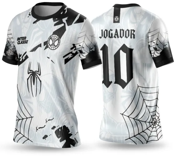 Camisa branca e preta com aranha grande e símbolos no peito, textos INTER CLASSE na frente e JOGADOR com número 10 nas costas, decorada com teias de aranha pretas e detalhes geométricos de fundo.