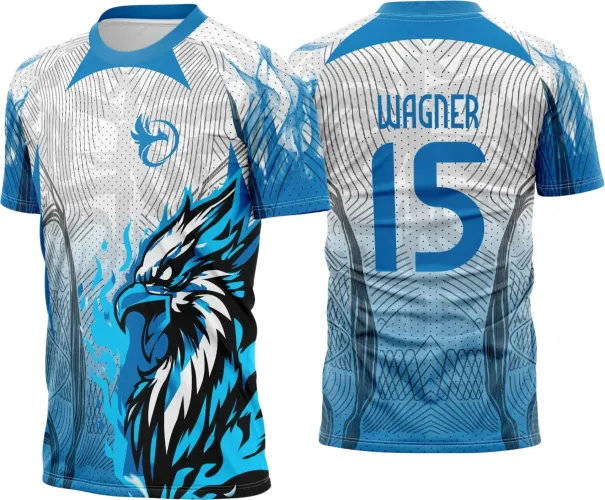 Camisa com frente branca detalhada por águia azul flamejante e gola azul; costas com degradê azul, nome WAGNER e número 15 em destaque sob fundo com padrão geométrico