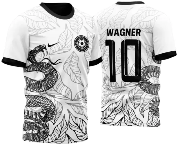 Camisa branca com gola e punhos pretos, frente destaca cobra preta enrolada sobre fundo de folhas pretas estilizadas, escudo circular FOOTBALL CHAMPIONS e logo Nike, costas exibem nome WAGNER, número 10 e continuidade da cobra com folhas