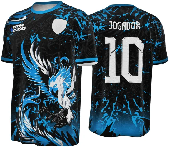 Camisa preta com detalhes em azul e branca, frente com fênix em pose agressiva e texto INTER CLASSE no peito, costas com número 10 e nome JOGADOR, respingos azuis dão efeito de movimento