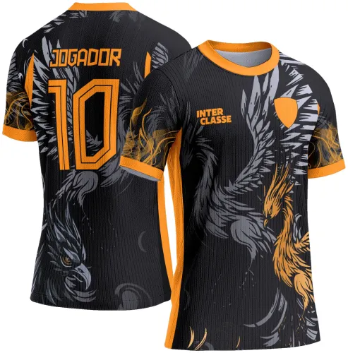 Camisa preta com gola e detalhes em laranja, frente destaca fênix em cinza e laranja com texto 'INTER CLASSE' e escudo laranja; costas exibem fênix em pose dinâmica, número 10 e texto 'JOGADOR' em laranja vibrante.