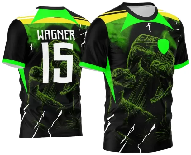 Camisa preta com detalhes neon verde e amarelo. Frente exibe três dinossauros verdes com escudo sem texto. Nas costas, nome WAGNER e número 15 em branco sobre a mesma arte dos dinossauros na base.