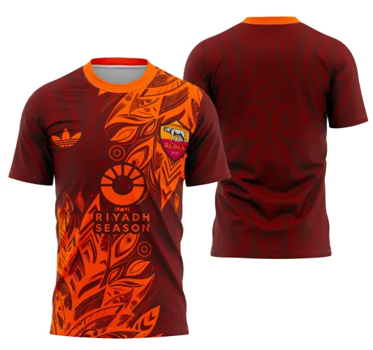 Camisa com frente em vermelho escuro e laranja, detalhes em folhas abstratas, escudo Roma com lobo e texto RIYADH SEASON em laranja, costas vermelhas com padrão abstrato. Gola laranja contrastante.