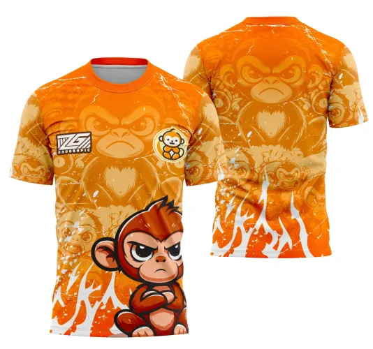 Camisa laranja vibrante com fundo de chamas brancas na frente e um macaco expressivo com braços cruzados. Nas costas, rosto grande de macaco em tons de laranja com olhar sério e detalhes de vários macacos ao fundo. Logo ZG e mascote em círculo no peito.