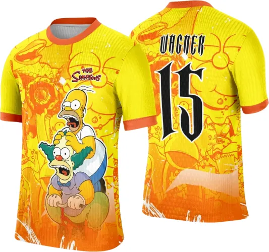 Camisa amarela degradê para laranja com Homer e Krusty na frente, nome WAGNER e número 15 em preto nas costas, fundo com personagens Simpsons em tons amarelo-laranja e mangas com borda laranja.