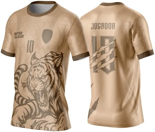 Camisa bege com estampa de tigre agressivo na frente, detalhe de número 10 e texto INTER CLASSE. Costas em bege com o texto JOGADOR e número 10 marcado por riscos de garra em marrom.