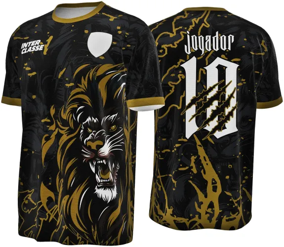 Camisa preta com detalhes dourados, frente mostra um leão rugindo em dourado e branco, costas exibem número 10 branco com marcas de garras douradas e texto 'JOGADOR' acima.