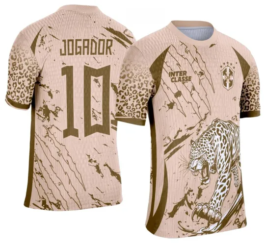 Camisa bege com onça marrom na frente em posição agressiva, texto INTER CLASSE e escudo com estrelas, costas com JOGADOR e número 10, mangas estampadas com padrão de onça em marrom.