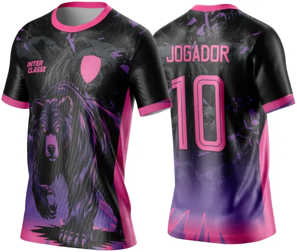 Camisa preta com design de urso atacando em rosa e roxo na frente, texto INTER CLASSE com escudo rosa; costas com número 10 e nome JOGADOR em rosa, degradês e detalhes gráficos em roxo e rosa.