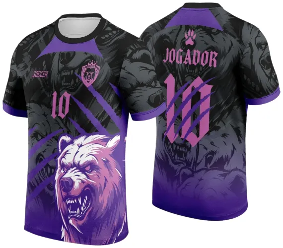 Camisa preta e roxa com um urso feroz branco e roxo estampado na frente, número 10 rosa e escudo com urso, nas costas vários ursos cinza escuro, número 10 grande com garras roxas e texto 'JOGADOR' em rosa.