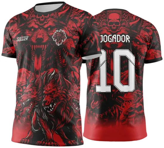 Camisa preta com degradê vermelho apresenta Cerberus vermelho de três cabeças à frente, com texto branco SOCCER e escudo da figura. Costas exibem grande número 10 branco com JOGADOR acima e detalhes em caveira e lobos vermelhos.