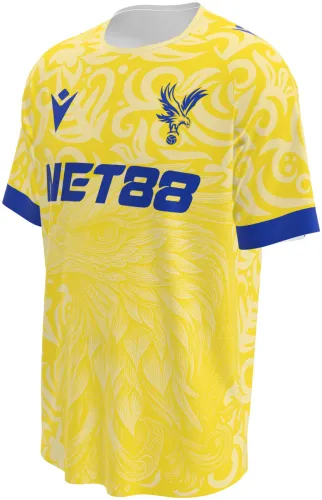 Camisa conceito do Crystal Palace 2026 amarela com águia e volutas tom sobre tom, frente e costas
