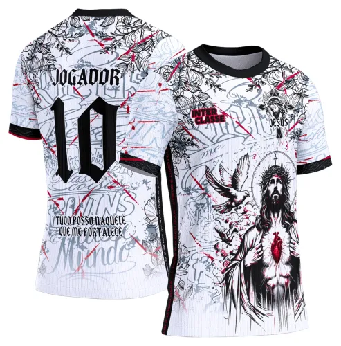 Camisa branca com arte frontal de Jesus com coração vermelho e pomba voando, textos 'INTER CLASSE' e 'JESUS'; costas com número 10, palavra 'JOGADOR' e frase motivacional. Detalhes em preto, linhas vermelhas e gola preta.