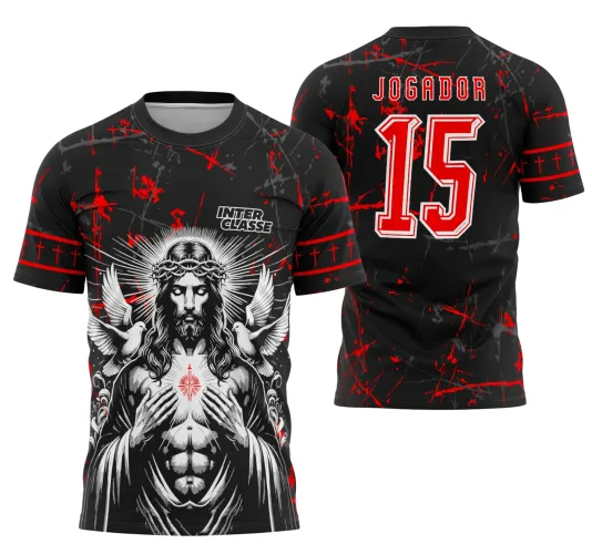 Camisa preta com arte frontal de Jesus Cristo em tons cinza, com coroa de espinhos e dois pombos brancos, fundo com respingos vermelhos. Costas exibem o texto JOGADOR e número 15 em vermelho e branco.