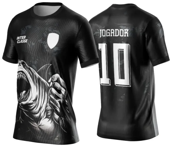 Camisa preta com tubarão agressivo em branco na frente, texto INTER CLASSE e escudo branco; edição nas costas com texto JOGADOR e número 10 em branco, fundo grafismo escuro degradê.