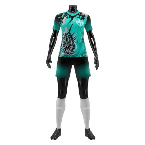 Camisa feminina de uniforme esportivo com estampa de tigre na frente, detalhes em preto e verde água, manchas artísticas e personalização de nome e número nas costas, cobrindo toda a peça.
