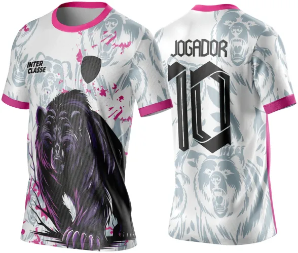 Camisa branca com estampa frontal de urso preto e roxo e texto INTER CLASSE, fundo branco com ursos cinza. Costas têm ursos cinza, número 10 e JOGADOR em preto, gola e mangas pink.