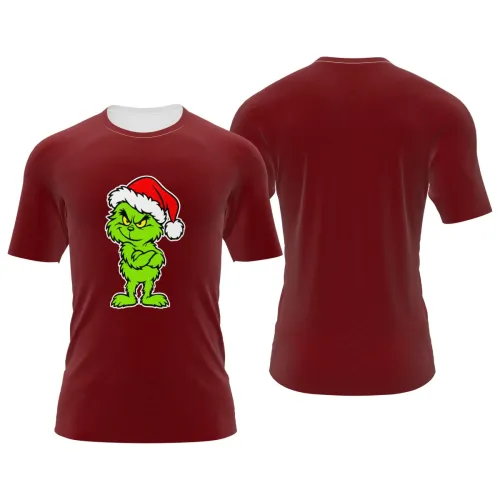 Camisa vermelha estampada por inteiro, com personagem verde emburrado usando gorro de Natal na frente, ideal para looks natalinos divertidos.