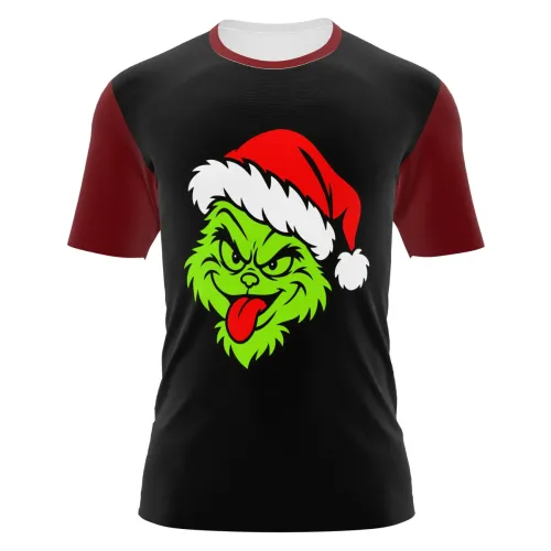 Camisa preta com mangas vermelhas, gola branca e estampa natalina divertida de rosto verde com expressão irreverente e gorro de Papai Noel na frente, cobrindo toda a peça.